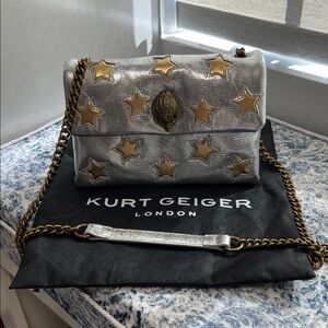 Brand New Kurt Geiger Silver Bag with Gold Stars.  Comes with dust bag.